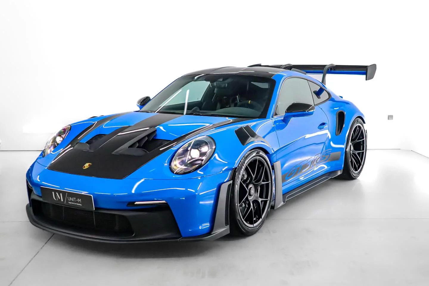 Porsche 911 GT3 RS — Bleu Shark, 3/4 avant studio